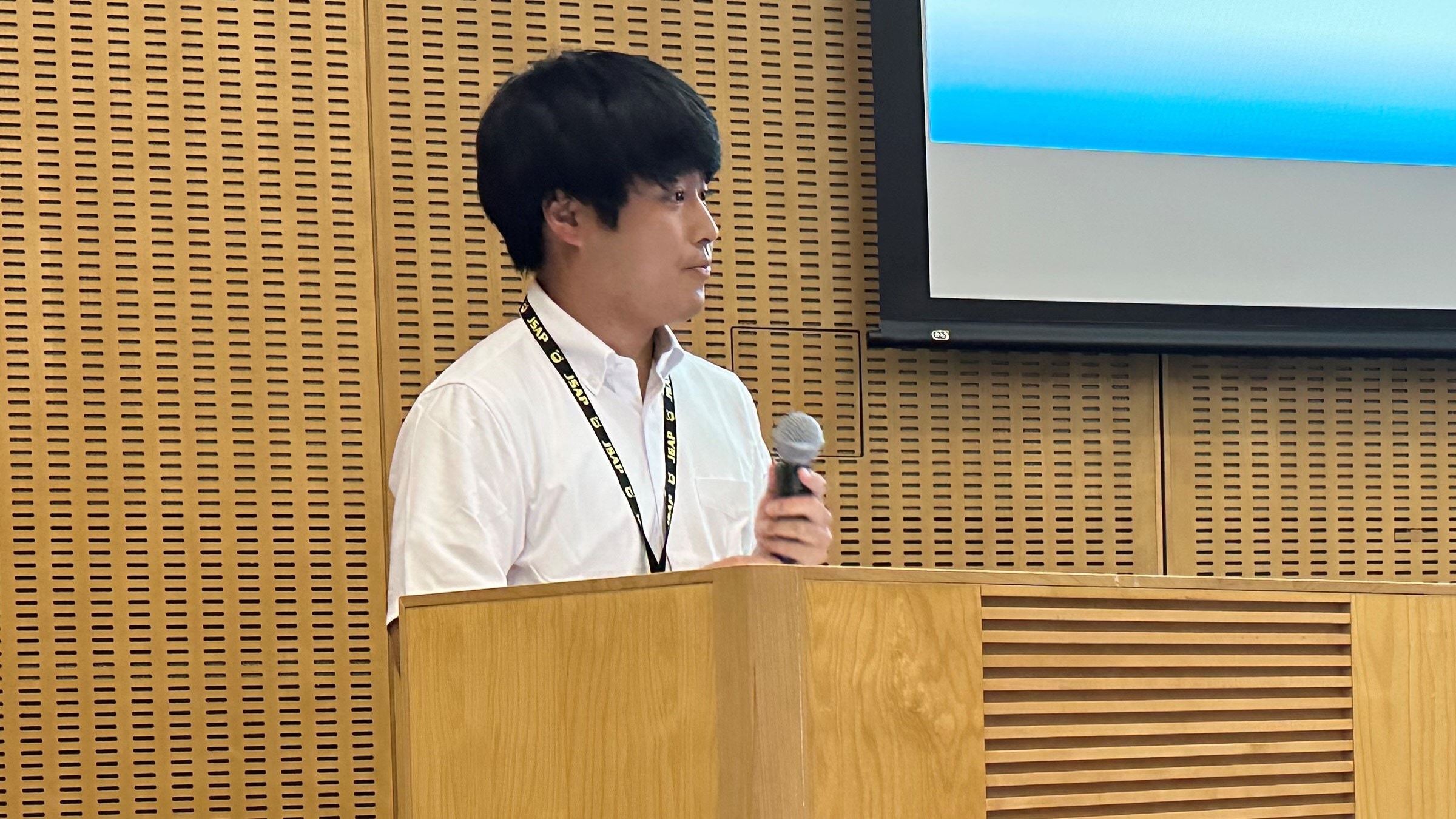 Mr. Kazuki Ozawa takes the podium with a touch of nervousness.