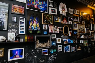 The wall of inspiration shows pictures of the firm's past works and ideas